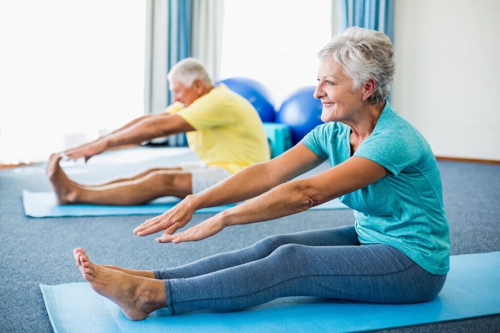 Healthy adult over 50 stretching in the morning to support natural energy and vitality