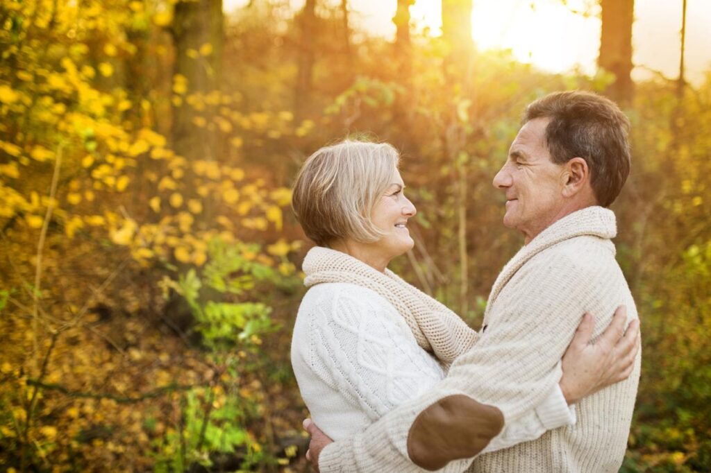 Healthy adults over 50 walking outdoors staying active and independent”