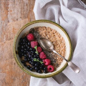 Healthy oatmeal breakfast with berries and walnuts after 50
