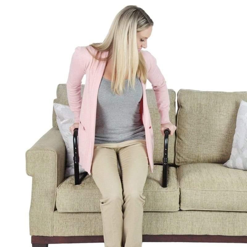 Senior using a standing aid to get up from a couch safely