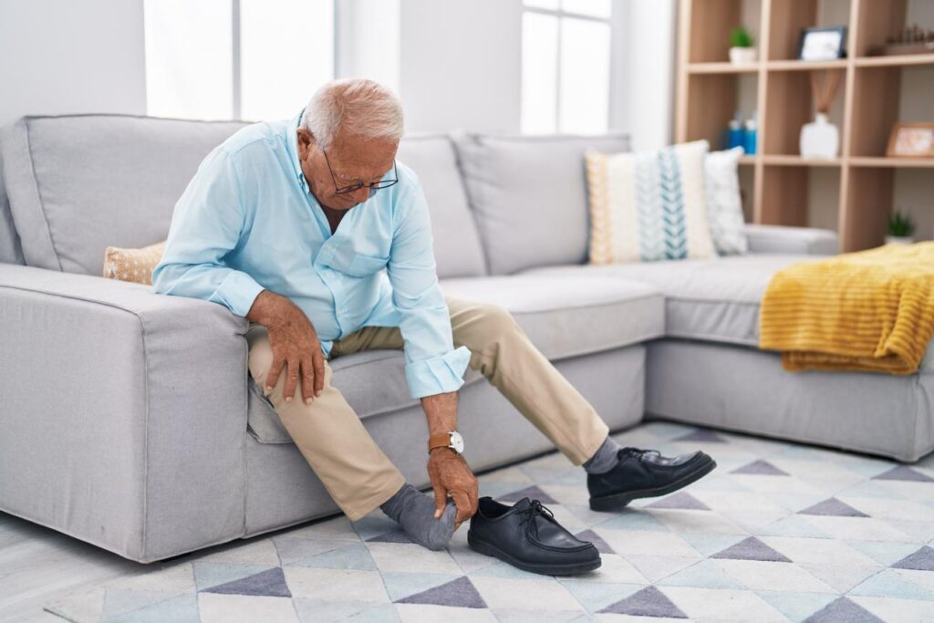 Older adult using no-tie shoelaces for seniors on walking shoes