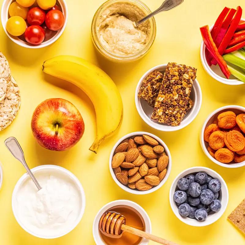 Low-sodium snacks after 50 including fruit nuts popcorn and vegetables